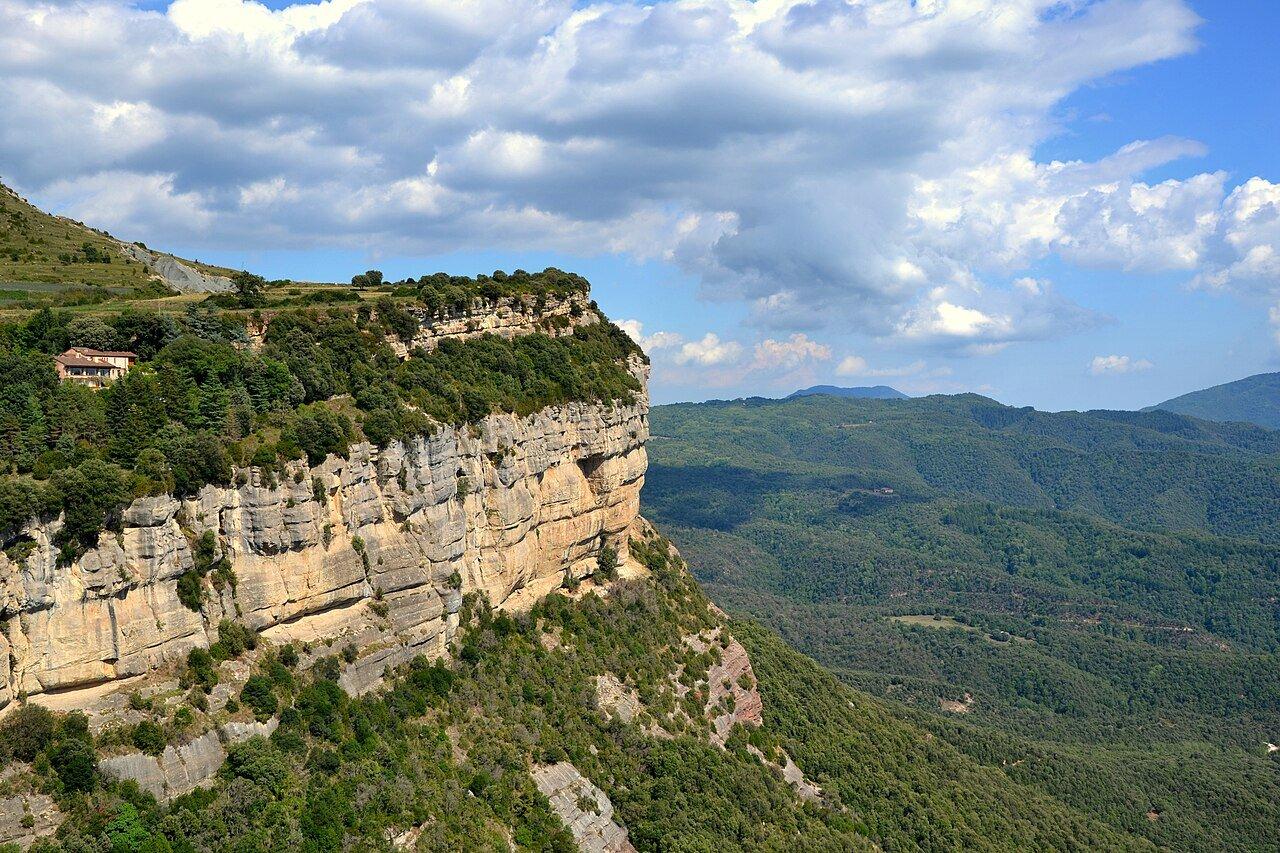 Tavertet’s limestone cliffs above a wooded valley