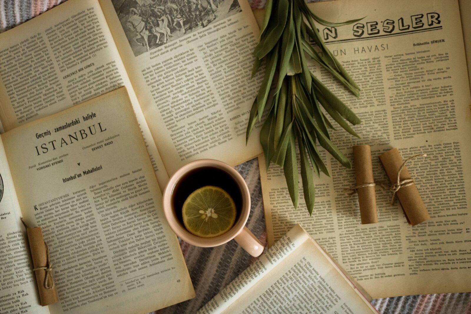 Open books and a cup of tea on a retreat table